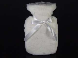 Fluffy white hot water bottle with ribbon detail. 26 x 14.5 cm
