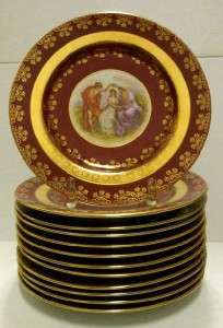   OF TWELVE GERMAN PORCELAIN PLATES WITH A MAKERS MARK OF A GOLD BEEHIVE