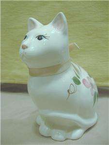 White porcelain cat w/pink flowers Artistic gifts Inc  