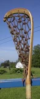 is a vintage wooden lacrosse stick. Measures 40 long. The lacrosse 