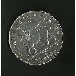 ONE ETHIOPIAN SILVER COIN, MENELIK EMPEROR ETHIOPIA ONE BIRR,(one inch 